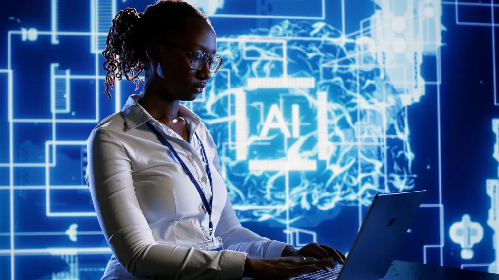 a person working on a laptop with the background with data particles and the word "AI"